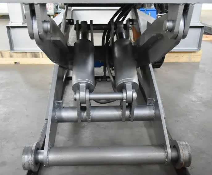Hydraulic coil unwinder for sheet metal processing and rollforming equipment
